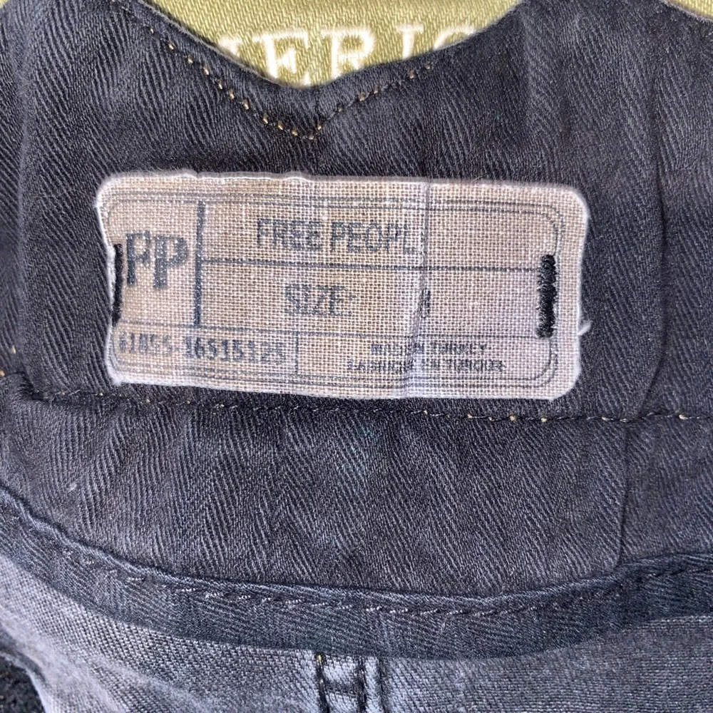 Free People distressed denim black mini skirt. Size 8